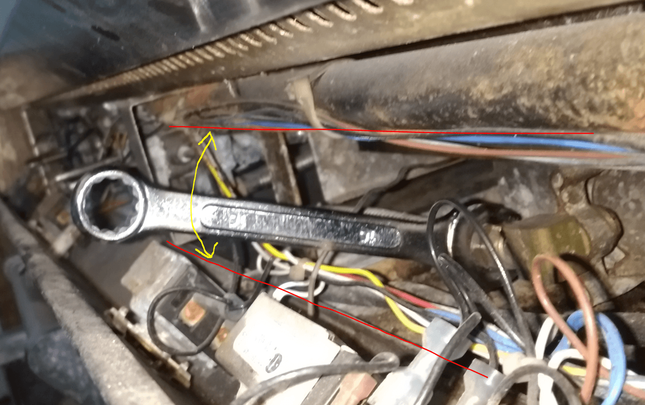 a hard to reach bolt in a car's engine bay